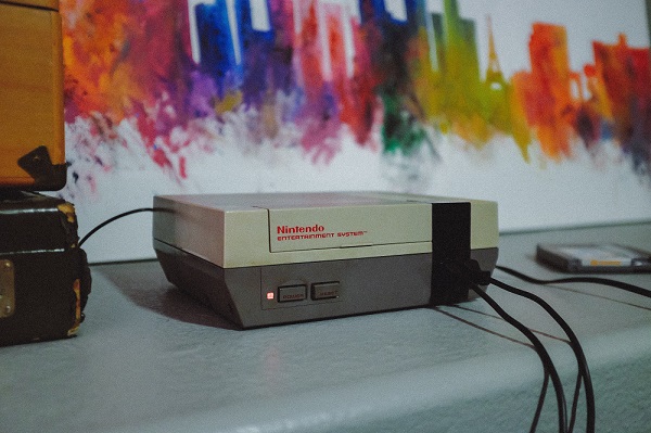 Nintendo System in front of painting